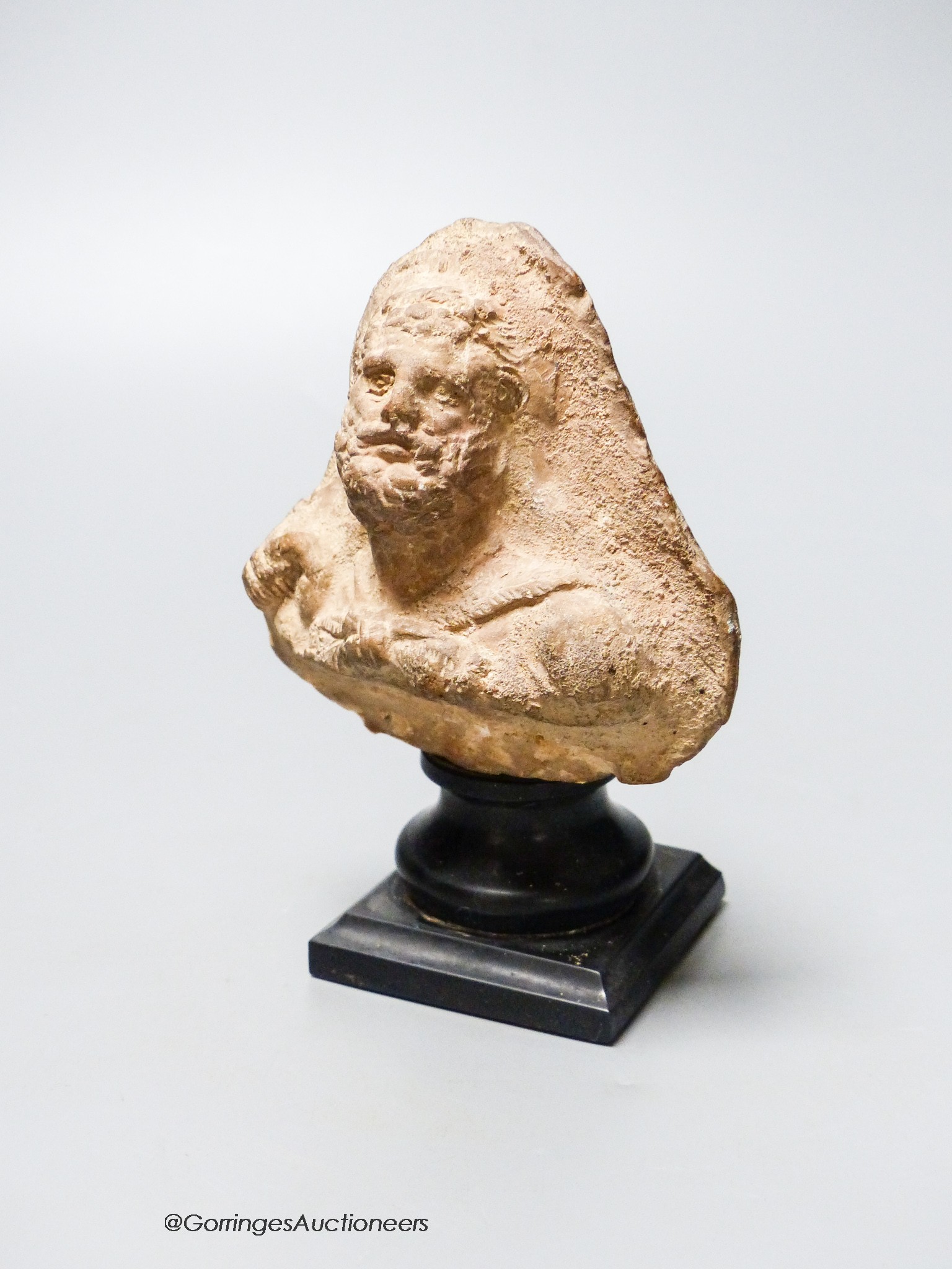 An Etruscan terracotta bearded portrait bust, height 12.5cm